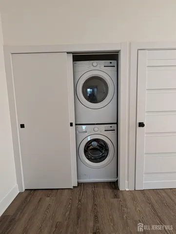 a view of a storage and utility room with washer and dryer