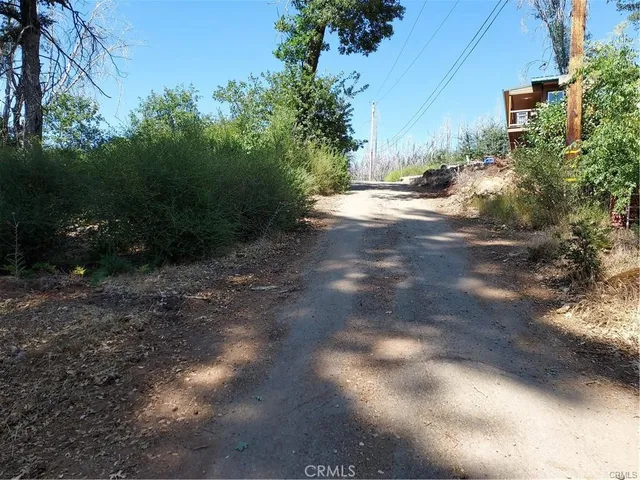 a backyard of a house with a yard and outdoor seating