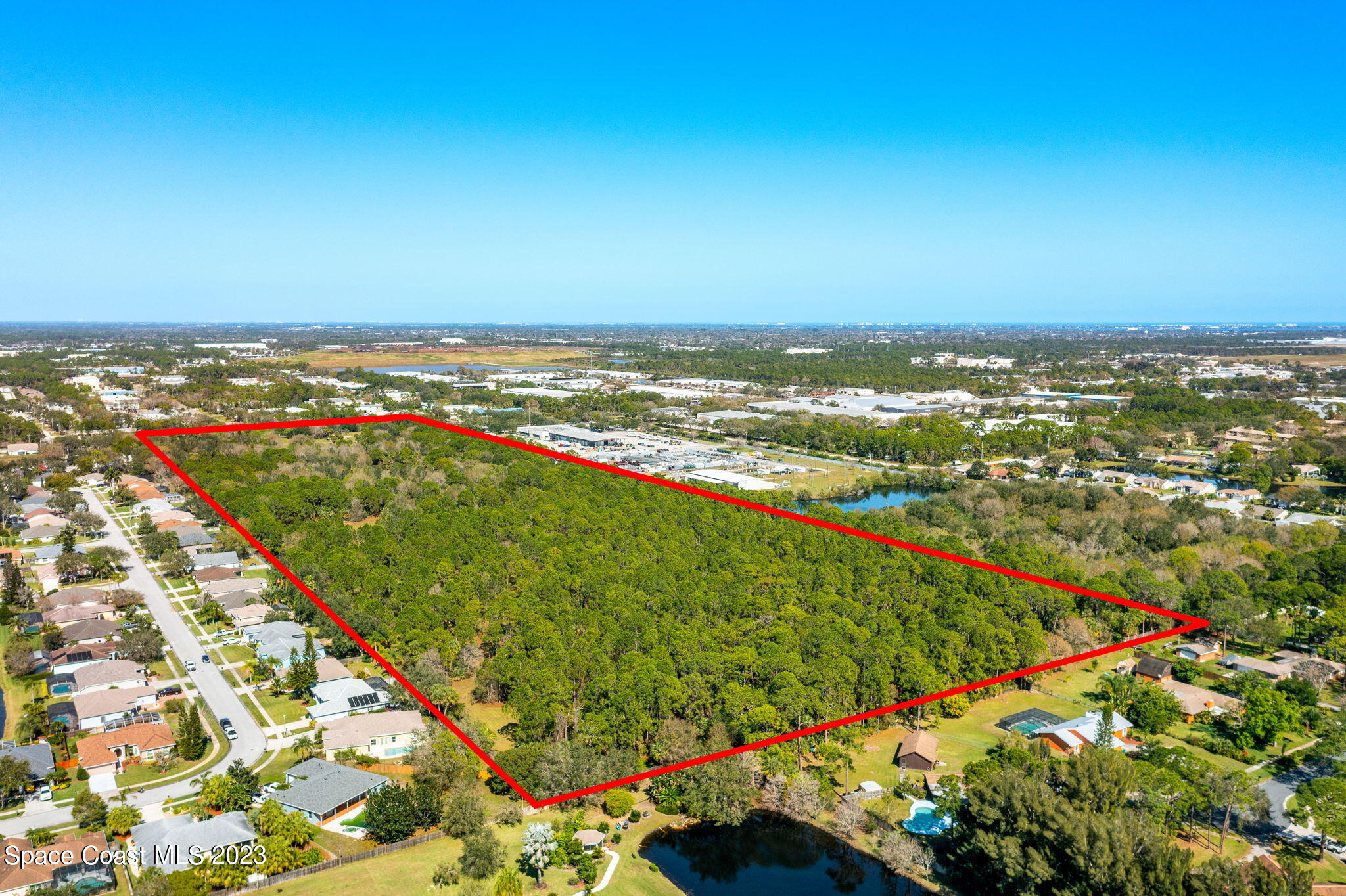 9035 Ellis Road Melbourne, FL 32904 - Photo 2 of 10 an aerial view of residential houses with outdoor space