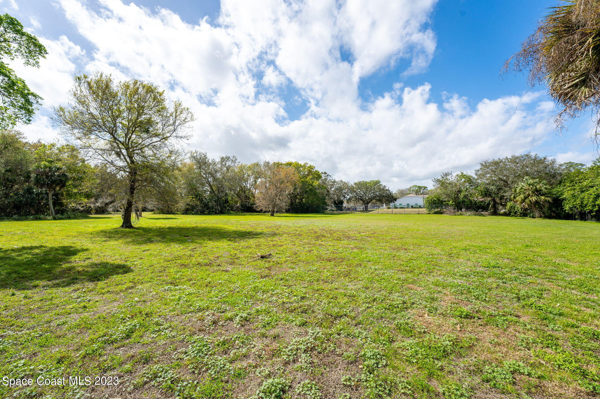9035 Ellis Road Melbourne, FL 32904 - Photo 5 of 10 a view of a garden and basketball court