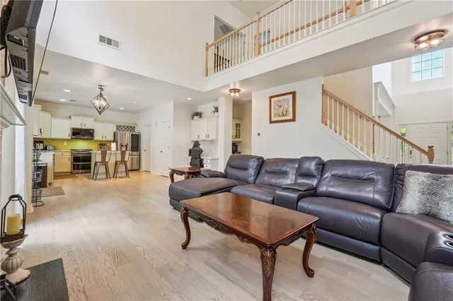 a bedroom with a bed and painting on the wall