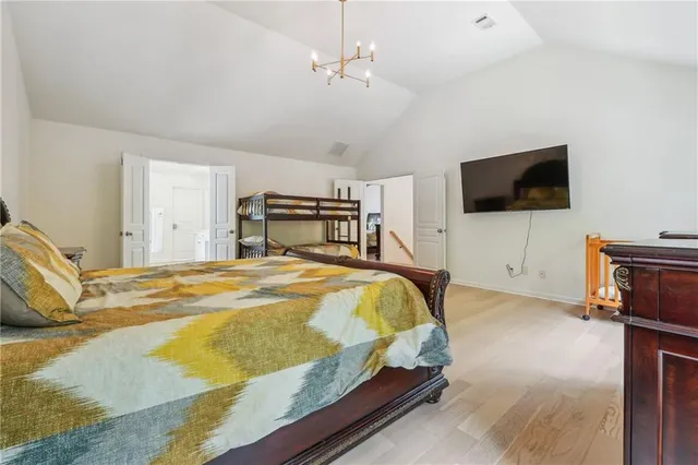 a bedroom with a bed and a dresser