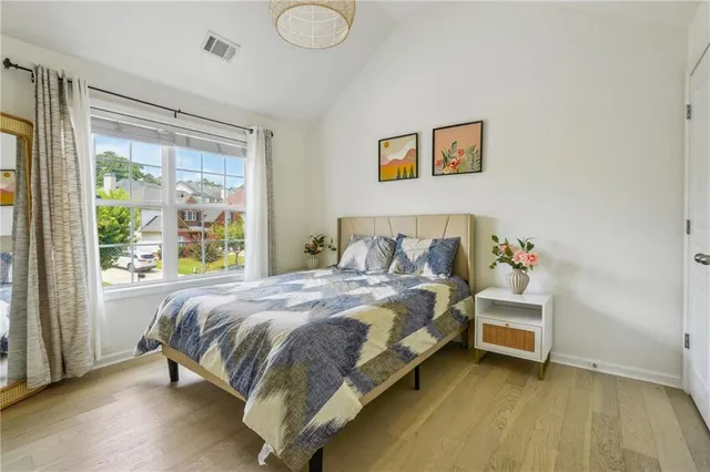a balcony with wooden floor and fence