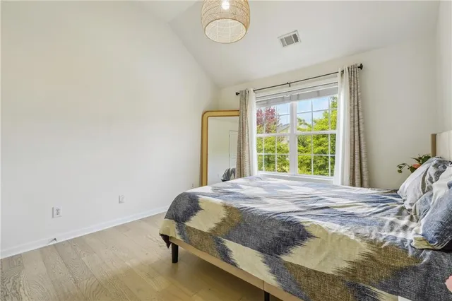 a view of a backyard with fence