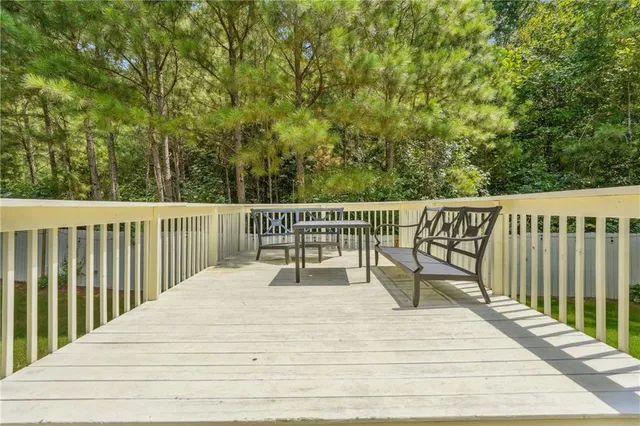 a view of a house with backyard and a hammock