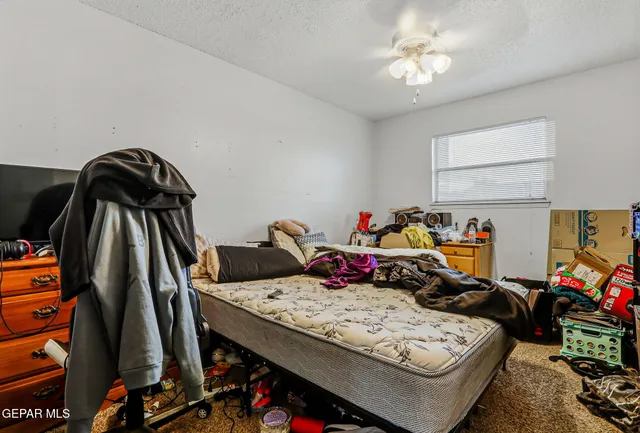 a bathroom with a sink vanity granite and toilet