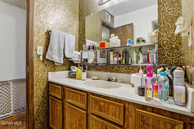 a bathroom with a sink and a mirror