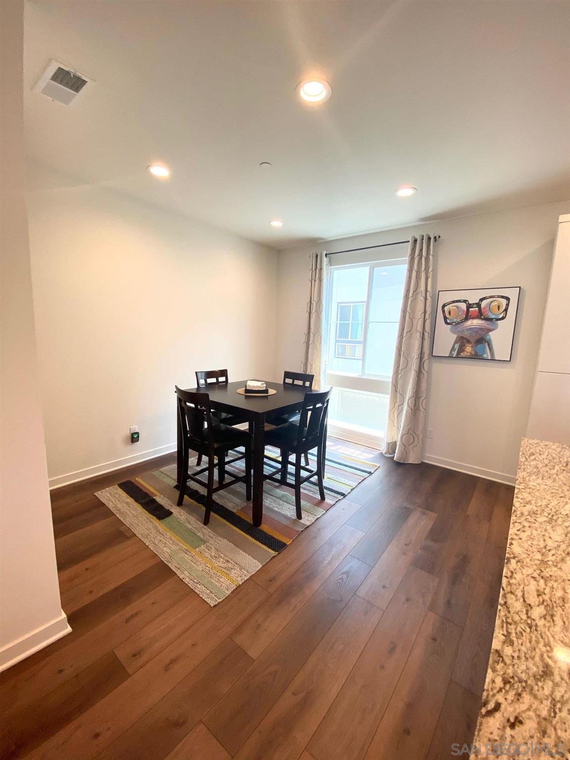 2135 Celestial Way, Unit 2 Chula Vista, CA 91915 - Photo 2 of 24 a living room with furniture and a wooden floor