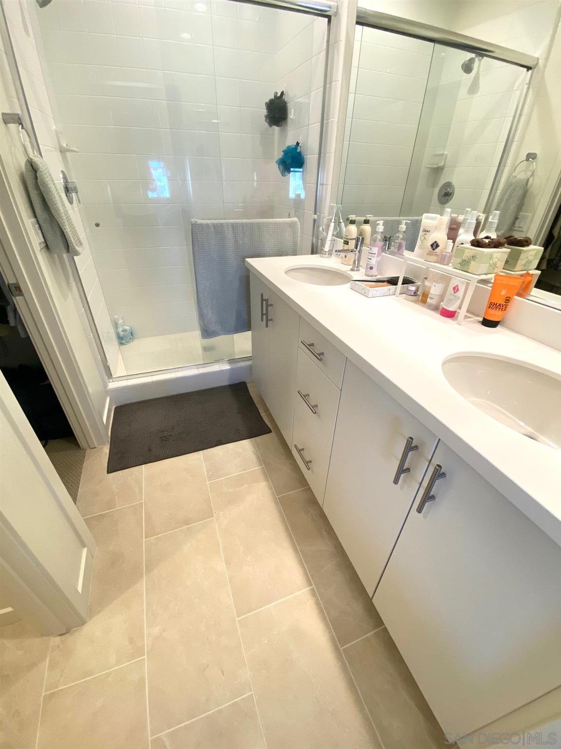 2135 Celestial Way, Unit 2 Chula Vista, CA 91915 - Photo 12 of 24 a bathroom with a sink a tub and a mirror