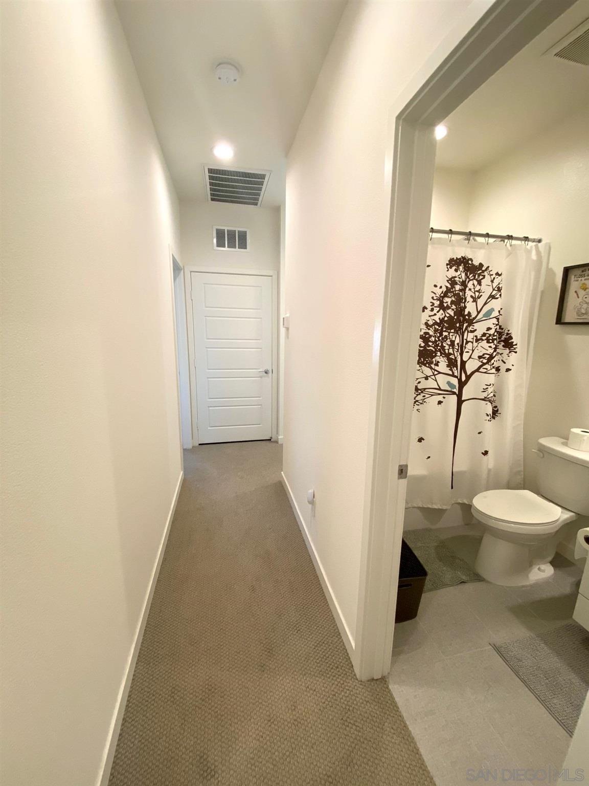 2135 Celestial Way, Unit 2 Chula Vista, CA 91915 - Photo 14 of 24 a bathroom with a toilet and a shower