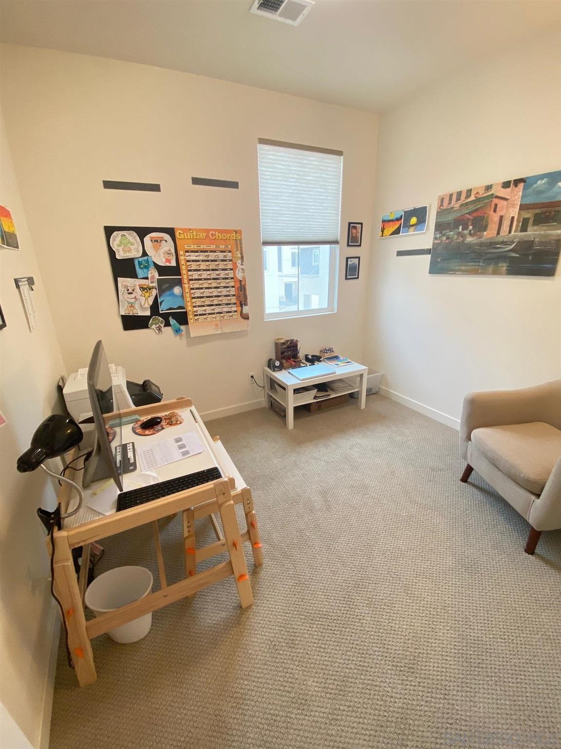 2135 Celestial Way, Unit 2 Chula Vista, CA 91915 - Photo 17 of 24 a bedroom with a bed and couch