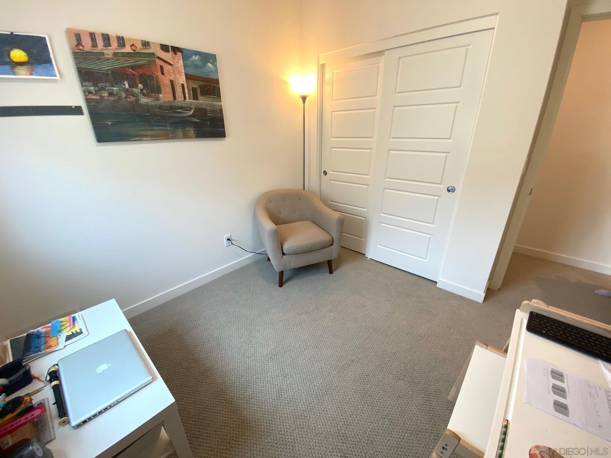 2135 Celestial Way, Unit 2 Chula Vista, CA 91915 - Photo 18 of 24 a living room with furniture and a window
