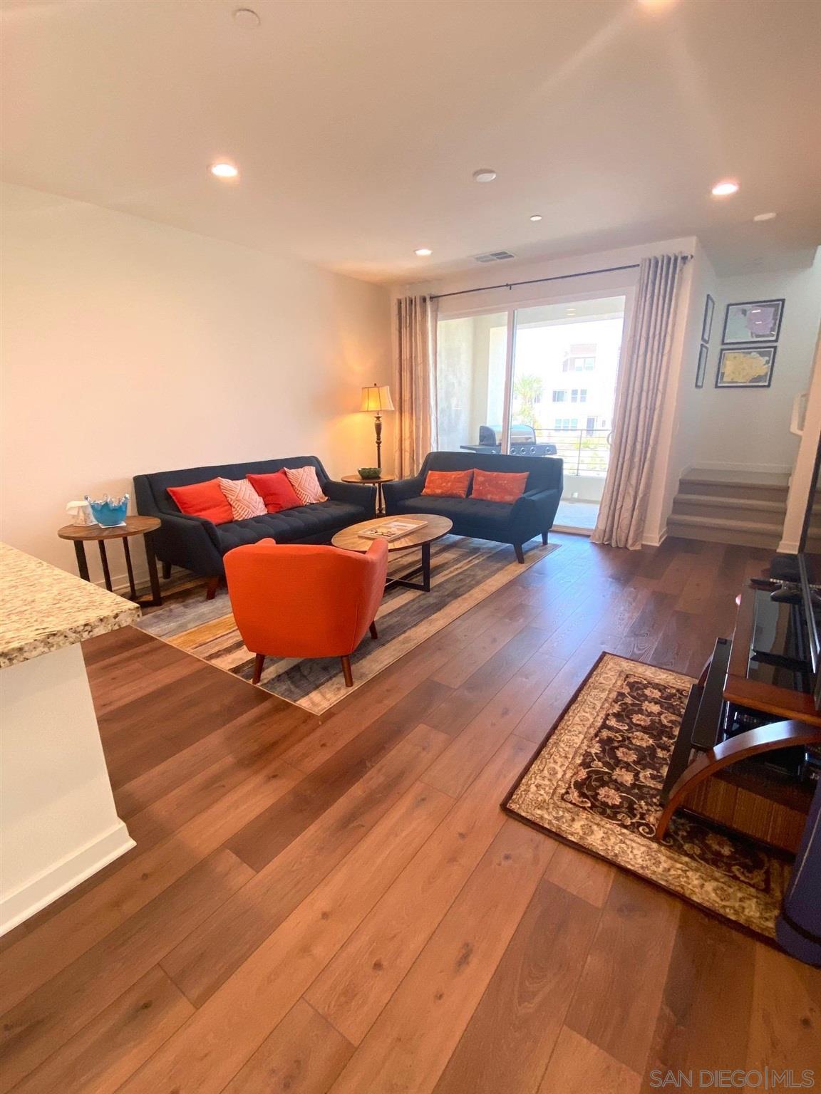 2135 Celestial Way, Unit 2 Chula Vista, CA 91915 - Photo 6 of 24 a living room with furniture and a wooden floor