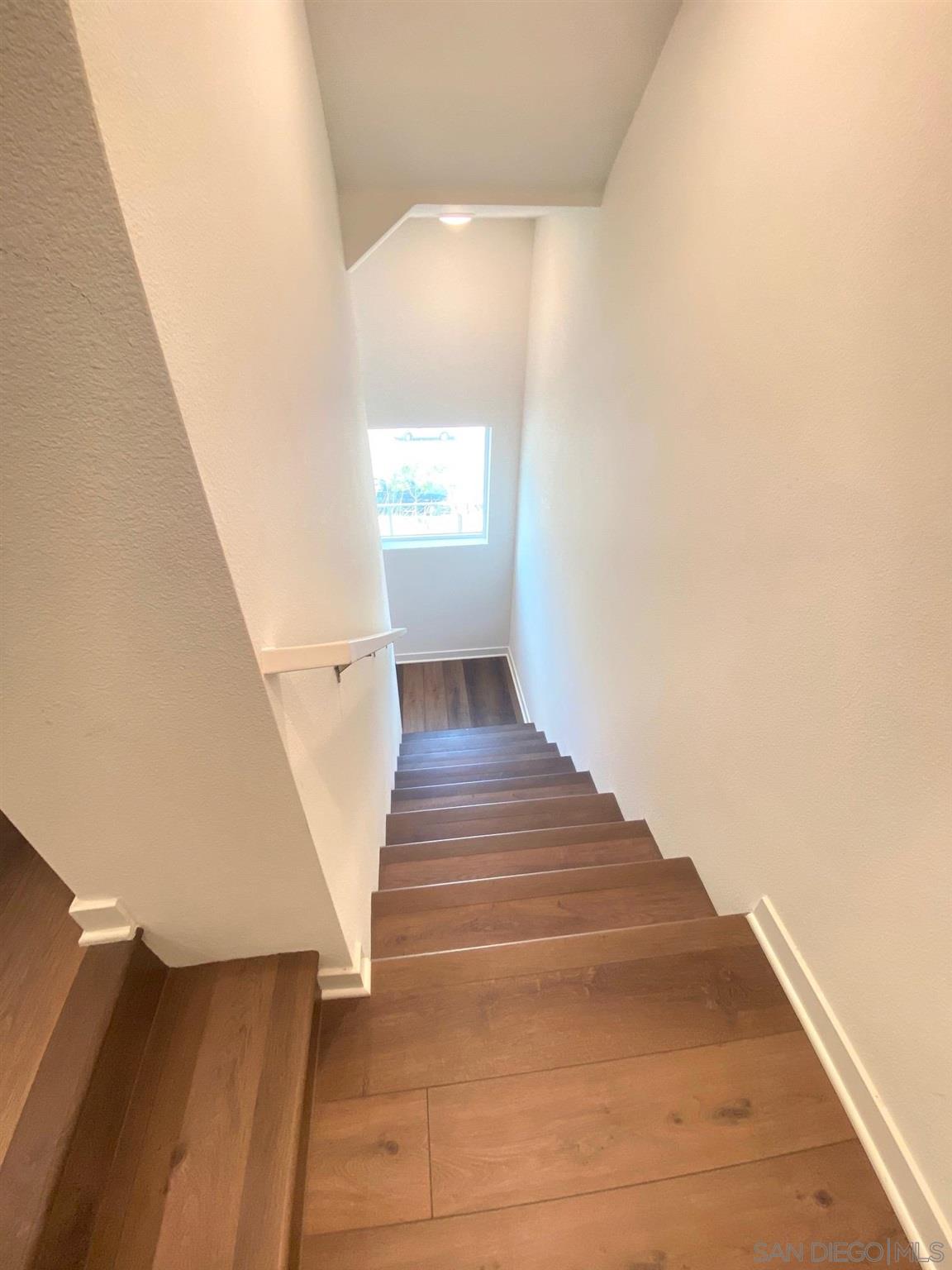 2135 Celestial Way, Unit 2 Chula Vista, CA 91915 - Photo 7 of 24 a view of entryway and hall with wooden floor