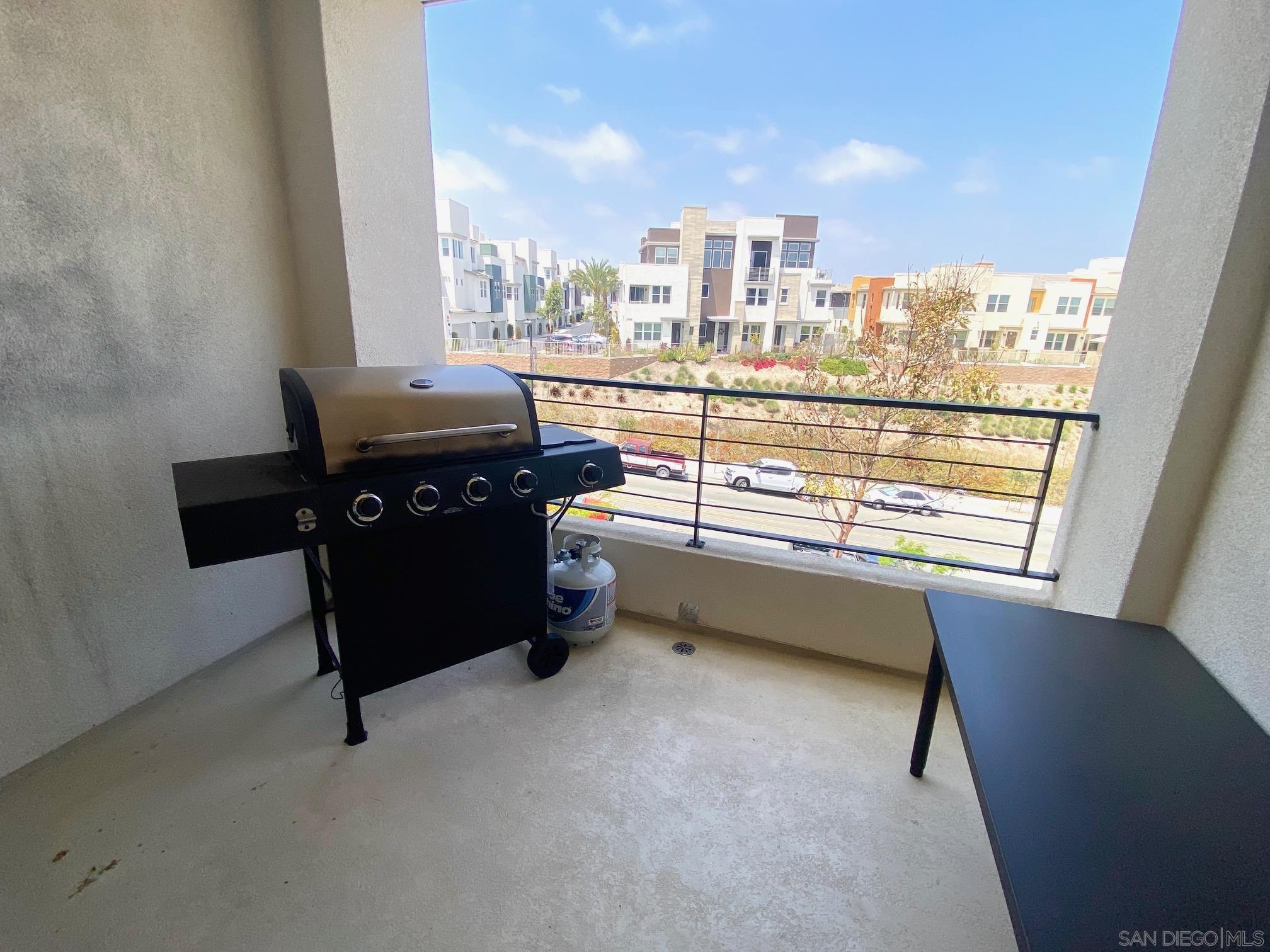 2135 Celestial Way, Unit 2 Chula Vista, CA 91915 - Photo 9 of 24 a kitchen with a fridge and a more window