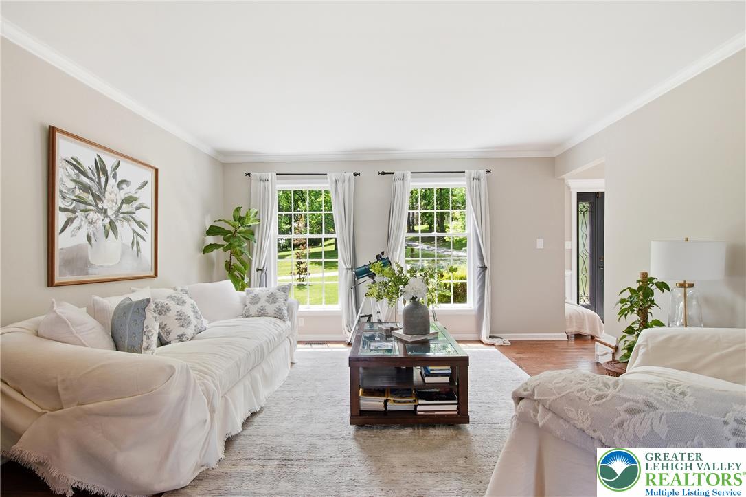 115 West Butternut Road Hellertown, PA 18055 - Photo 28 of 97 Hardwood floors and generous natural light create an inviting atmosphere in this refined living area.