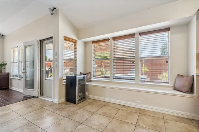 a living room with furniture and large windows
