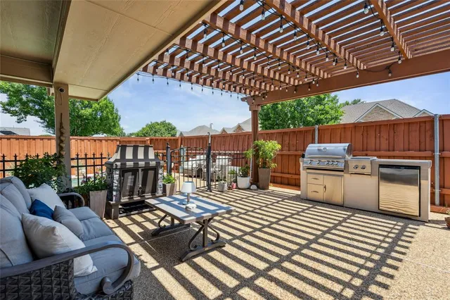 a view of a chairs and table in the patio