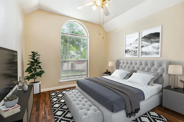 a bedroom with bed and a window