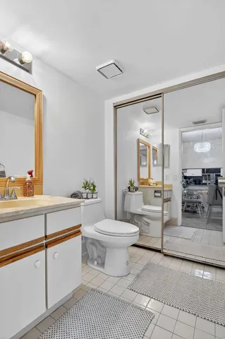 a view of a patio with table and chairs potted plants with wooden fence
