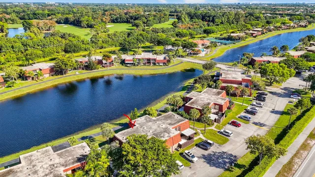 an aerial view of a house with a yard basket ball court