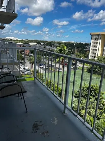 a view of a balcony with chairs