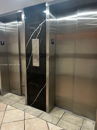 a bathroom with a shower and a mirror
