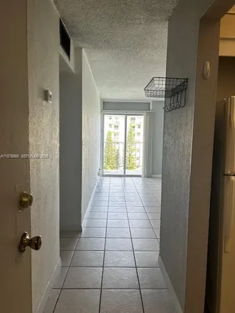 a bathroom with a granite countertop shower a window