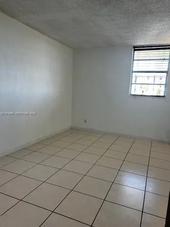 an empty room and window