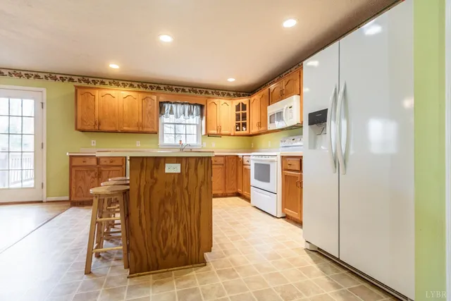 wooden floor fireplace and windows in an empty room
