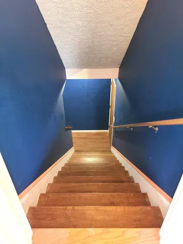 a view of balcony with wooden floor and outdoor seating