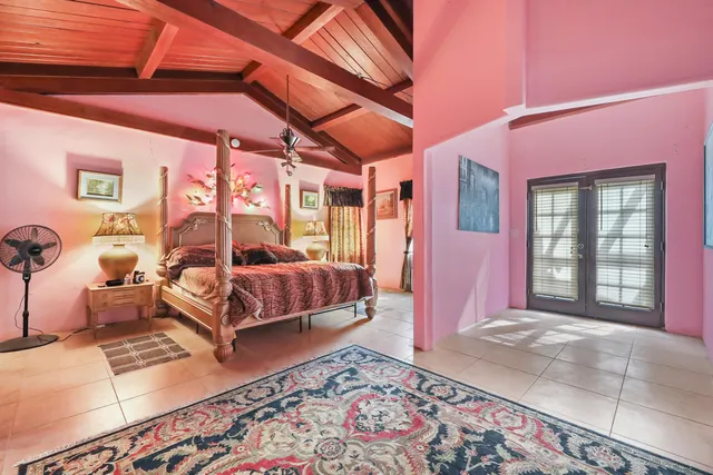 a living room with furniture a rug and a flat screen tv