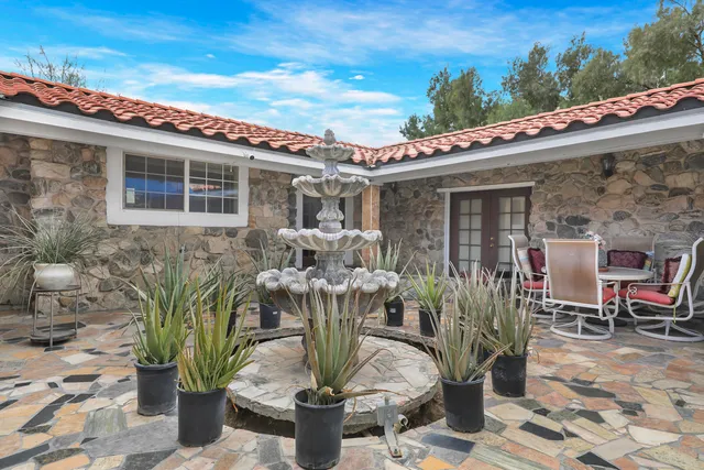 a view of a street with a building in the background