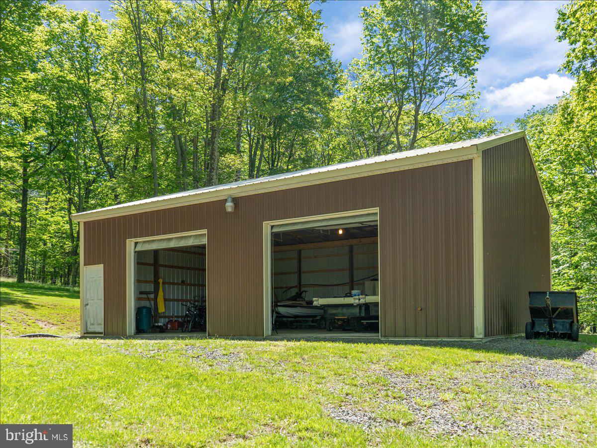 663 Bear Woods Road Mount Storm, WV 26739 - Photo 62 of 73 Spacious garage nestled in nature.