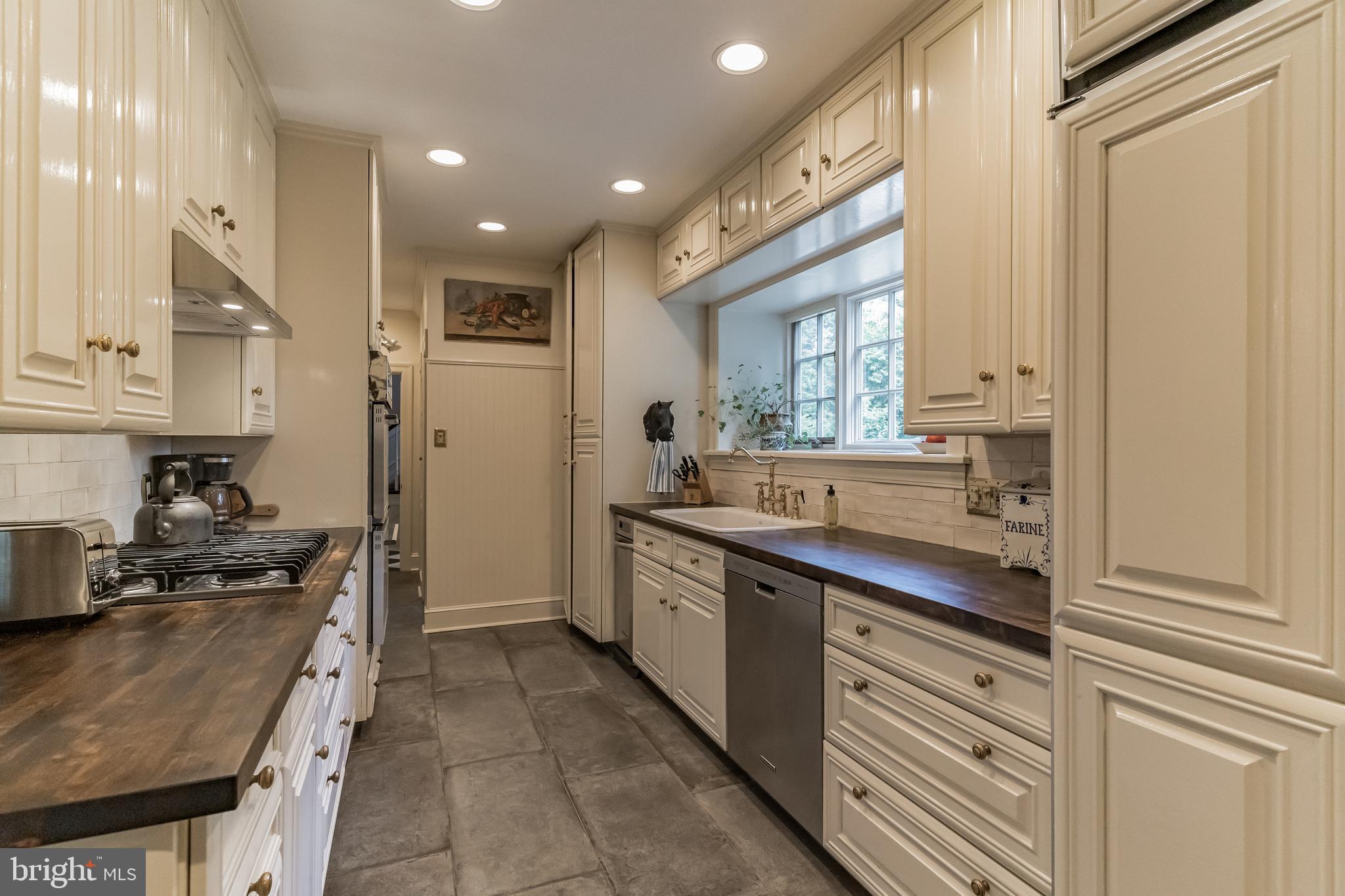 1413 Pepper Road Jenkintown, PA 19046 - Photo 17 of 65 a kitchen with stainless steel appliances granite countertop a sink and cabinets