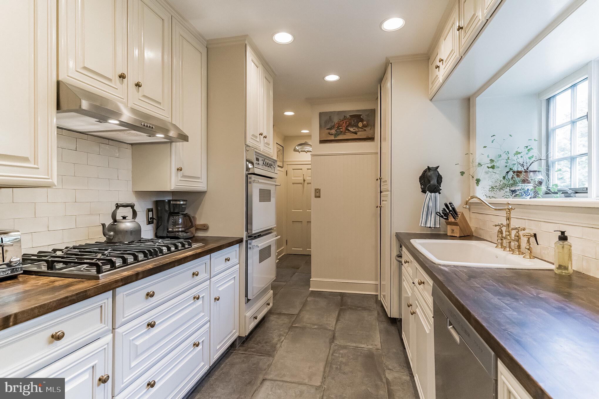 1413 Pepper Road Jenkintown, PA 19046 - Photo 18 of 65 a kitchen with stainless steel appliances granite countertop a sink stove and refrigerator