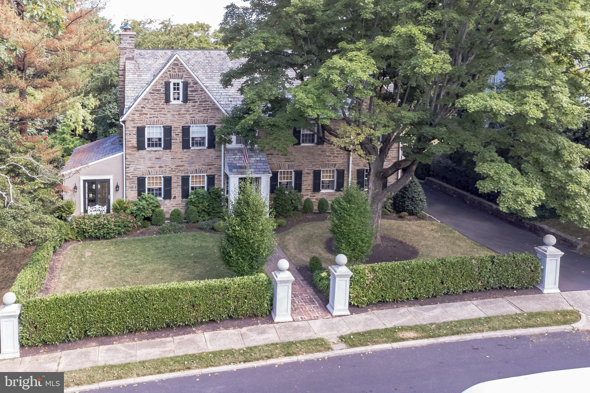 1413 Pepper Road Jenkintown, PA 19046 - Photo 2 of 65 a front view of a house with a yard and garage