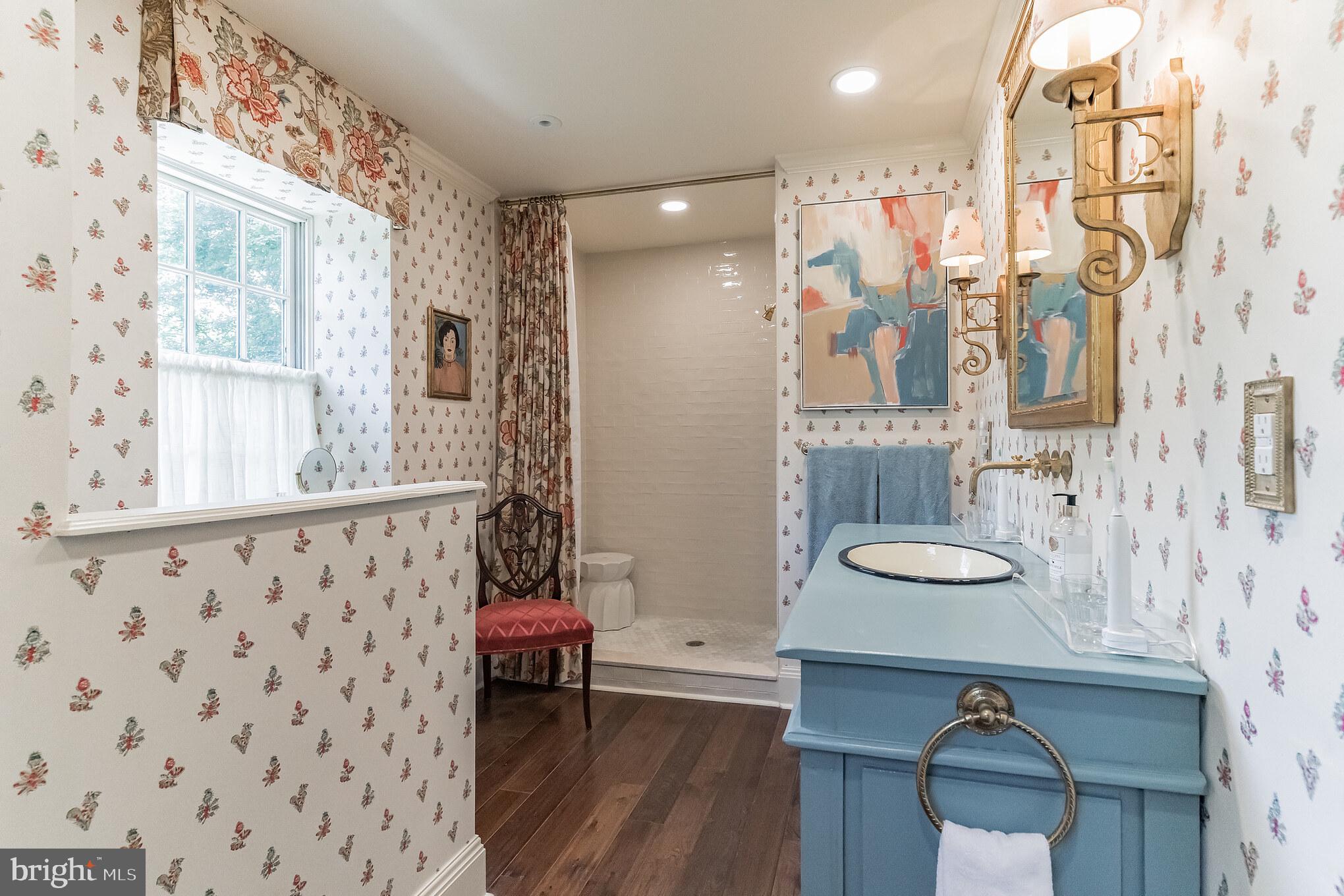 1413 Pepper Road Jenkintown, PA 19046 - Photo 29 of 65 a bathroom with a sink a mirror and a shower