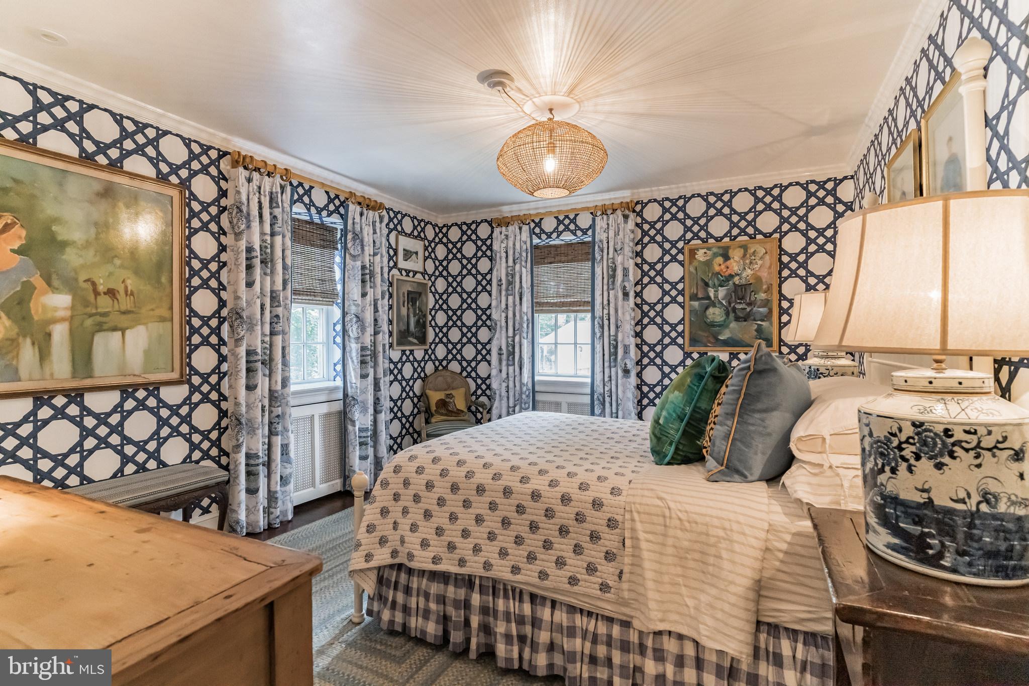 1413 Pepper Road Jenkintown, PA 19046 - Photo 35 of 65 a bedroom with a bed and dresser with mirror