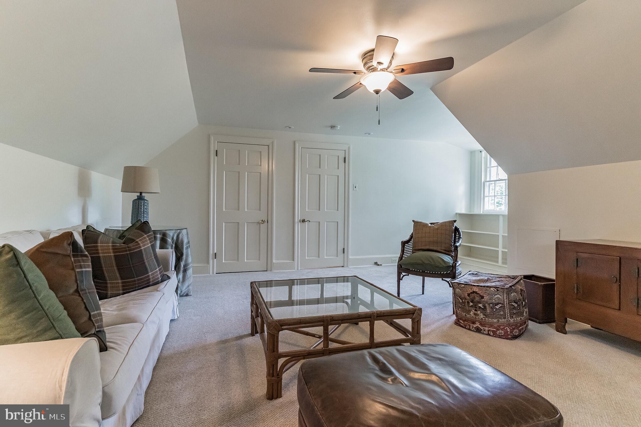 1413 Pepper Road Jenkintown, PA 19046 - Photo 38 of 65 a living room with furniture a ceiling fan and a rug