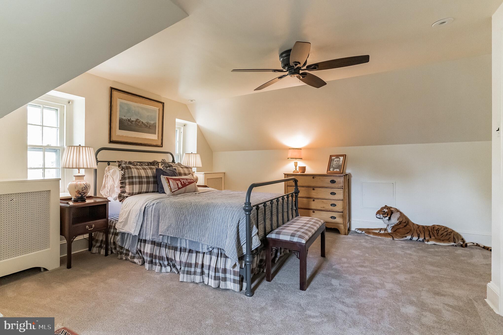 1413 Pepper Road Jenkintown, PA 19046 - Photo 41 of 65 a bedroom with a bed and a chandelier