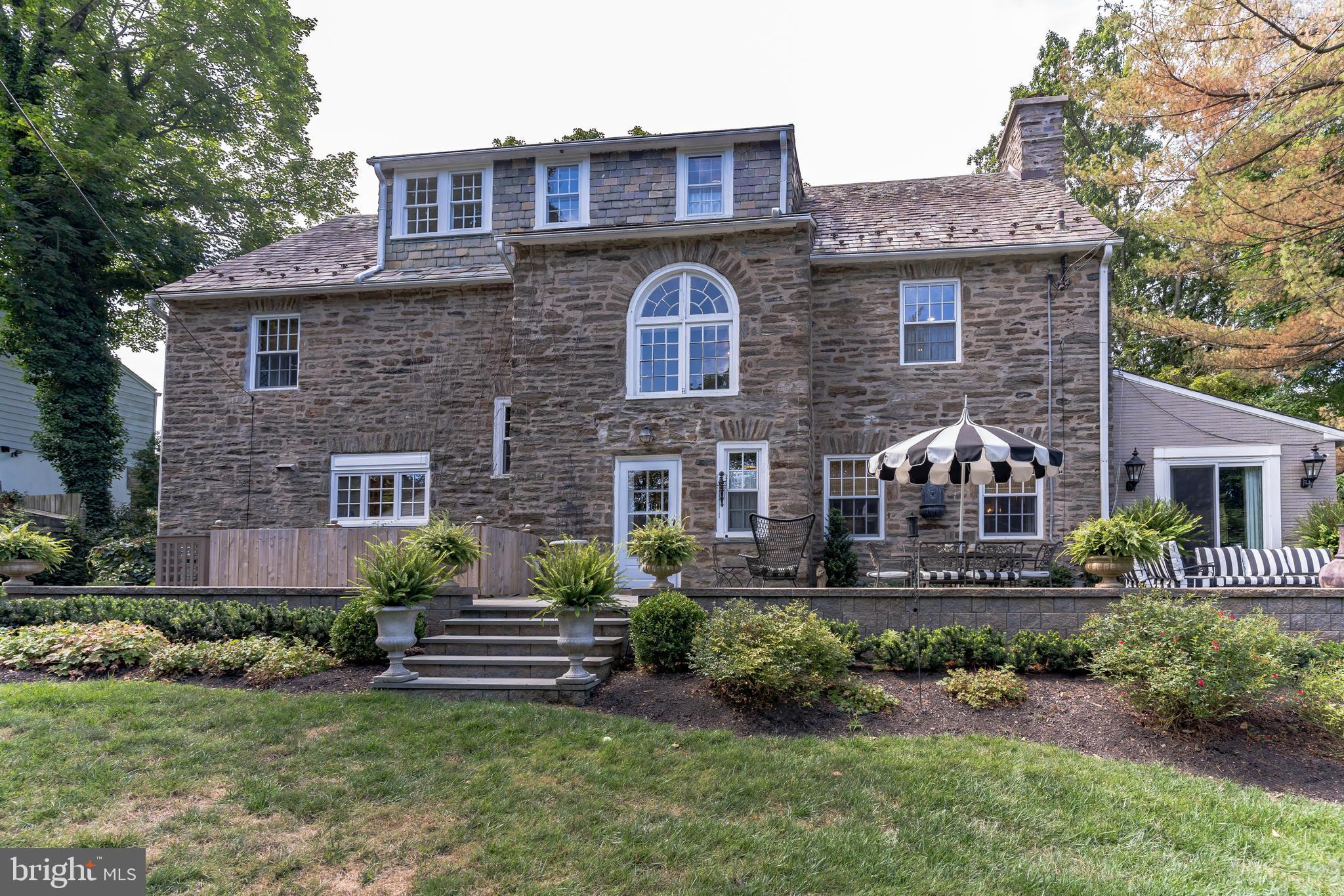 1413 Pepper Road Jenkintown, PA 19046 - Photo 45 of 65 a front view of a house with a garden