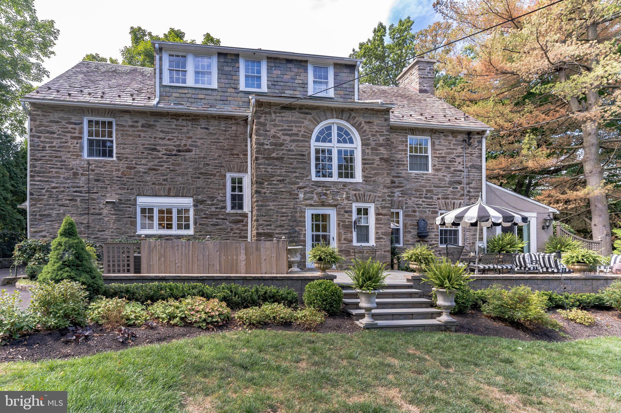 1413 Pepper Road Jenkintown, PA 19046 - Photo 54 of 65 a front view of a house with a garden