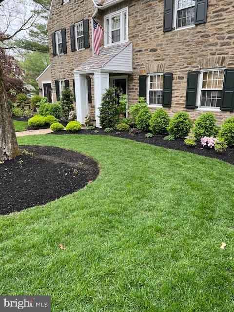 1413 Pepper Road Jenkintown, PA 19046 - Photo 63 of 65 a front view of a house with a yard and trees