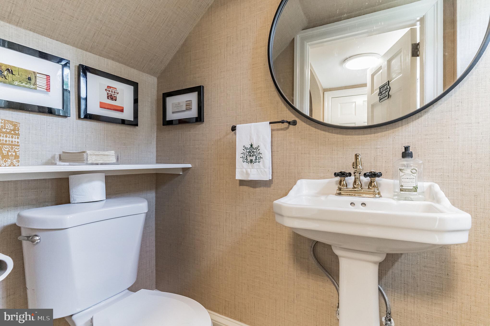 1413 Pepper Road Jenkintown, PA 19046 - Photo 8 of 65 a bathroom with a sink a mirror and a toilet