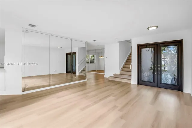 a view of an empty room with stairs