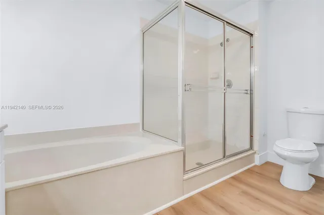 a view of yard with swimming pool and seating area