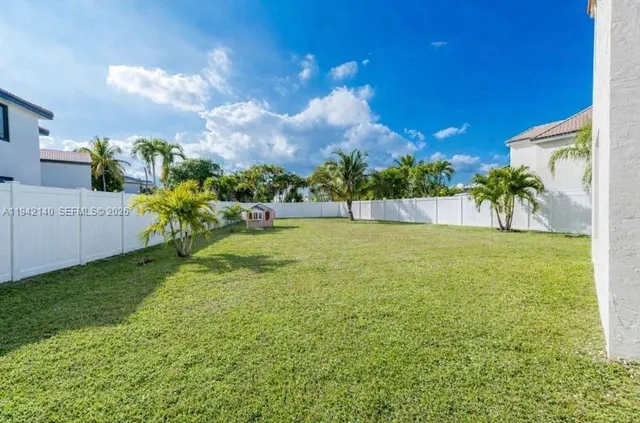 an aerial view of residential houses with swimming pool
