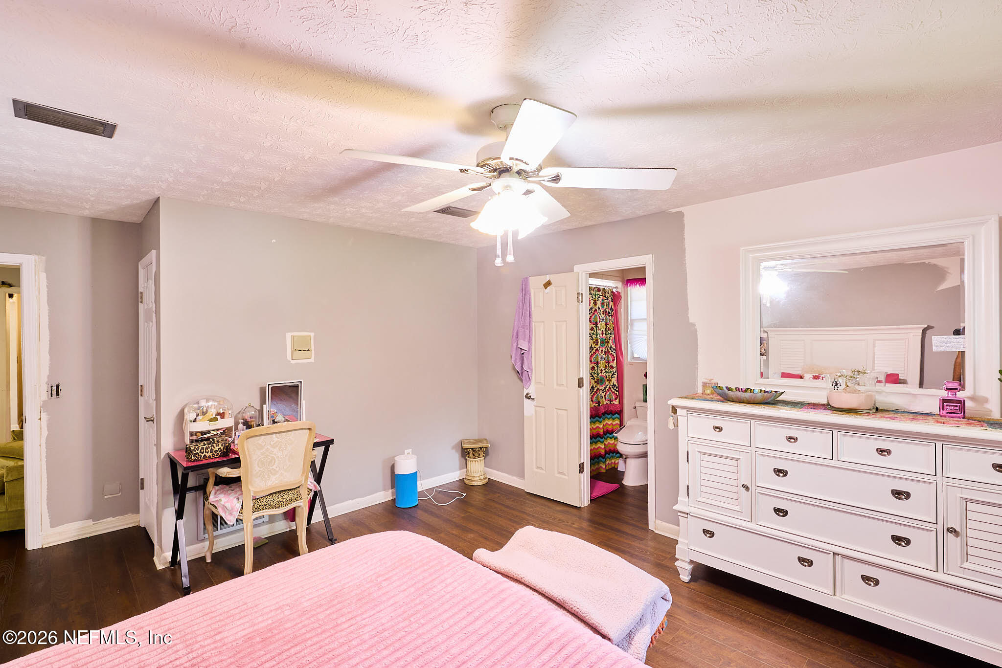 8965 San Rae Road Jacksonville, FL 32257 - Photo 18 of 46 a bedroom with a bed and a dresser in it