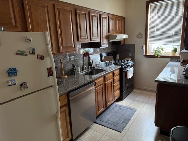 355 85th Street Brooklyn, NY 11209 - Photo 9 of 15 a kitchen with stainless steel appliances granite countertop a sink stove and cabinets